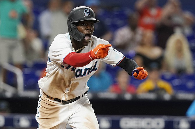 MIAMI Marlins second baseman Jasrado “Jazz” Chisholm Jr (2) reacts to a call after his two-run double in the seventh inning of a baseball game against the Arizona Diamondbacks on Tuesday in Miami. The ball was initially ruled out, after a review, it was ruled a fair ball. 
(AP Photo/Marta Lavandier)