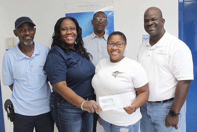 CWCO sponsor company, general manager Henderson Cash with associates Jeffery Burrows, Mrs Welliya Cargill and Robert Ferguson, presented a cheque to Black Marlins Swim Club secretary Mrs Danielle Sweeting-Wilson, who expressed thanks for the much-needed donation. Shown, from left to right, are Burrows, CWCO operations supervisor Cargill, CWCO accounts manager Sweeting-Wilson, Black Marlins Swim Club secretary Henderson Cash, CWCO general manager. Robert Ferguson, CWCO maintenance supervisor can be seen in the back row.