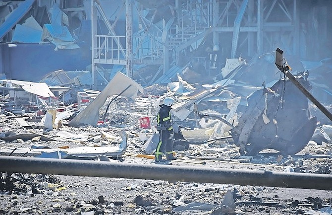 A UKRAINIAN firefighter works near a destroyed building on the outskirts of Odesa, Ukraine,
Tuesday. (AP Photo/Max Pshybyshevsky)