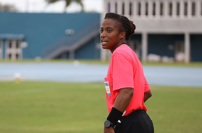 KRYSTAL Evans officiates as an assistant referee in The Bahamas’ match against the Turks and Caicos Islands at the weekend.
PHOTOS: Racardo Thomas/Tribune staff