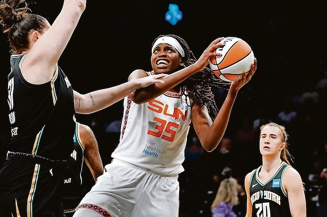 Connecticut Sun forward Jonquel Jones (35) shoots against New York Liberty centre Stefanie Dolson (31) in the first half during a WNBA basketball game, Tuesday, in New York. (AP Photo/John Minchillo)