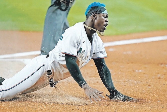 MIAMI Marlins’ Jazz Chisholm Jr. scores on a sacrifice fly hit by Jesus Aguilar during the first inning of a baseball game against the Washington Nationals, Wednesday, in Miami. (AP Photo/Lynne Sladky)
