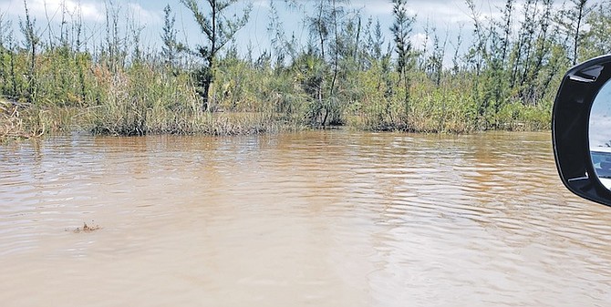 A ROAD becomes a river - a number of locations particularly in western New Providence were badly hit by flooding after heavy rainfall on the weekend of May 13-15.