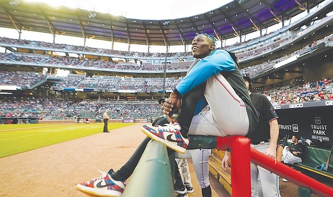 MIAMI Marlins second baseman Jazz Chisholm Jr watches from the dugout railing between innings of the team’s baseball game against Atlanta Braves on Friday, May 27, in Atlanta. Chisholm was not in the starting lineup. 
(AP Photo/John Bazemore)