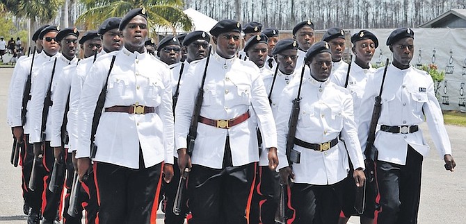 OFFICERS during the ceremony in Grand Bahama. Photo: Vandyke Hepburn