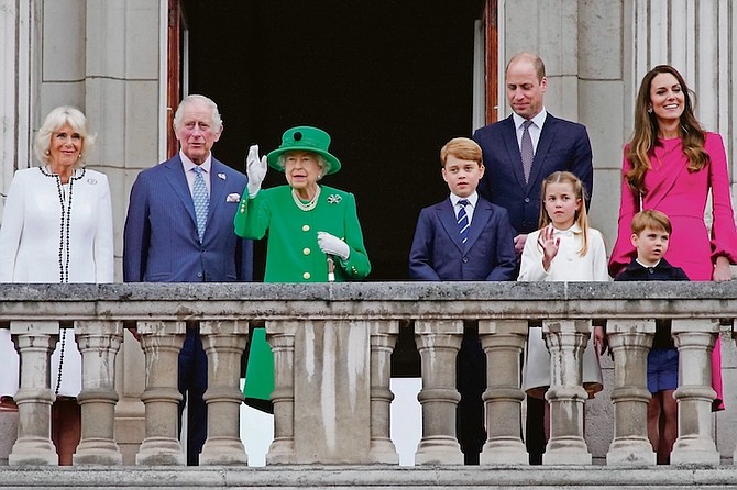 From left, Camilla Duchess of Cornwall, Prince Charles, Queen Elizabeth II, Prince George, Prince William, Princess Charlotte, Prince Louis, and Kate, Duchess of Cambridge appear on the balcony of Buckingham Palace during the Platinum Jubilee Pageant on Sunday. Photo: Frank Augstein/AP