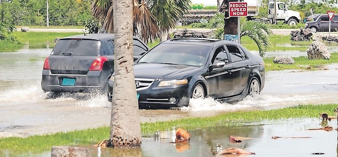 FLOODING on Blake Road yesterday.
Photos: Donavan McIntosh/Tribune Staff
