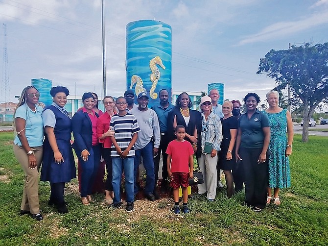 FOUR seahorse mosaic murals created by artist Jackie Boss were unveiled at the roundabout of West Atlantic Drive and Settler’s Way on June 2 as part of a project by the Grand Bahama Port Authority’s Keep Grand Bahama Clean Committee to beautify Freeport. Fourth from right is Sarah St George, chairman of Grand Bahama Port Authority, and fourth from left is artist Jackie Boss. 
Photo: Denise Maycock/Tribune Staff