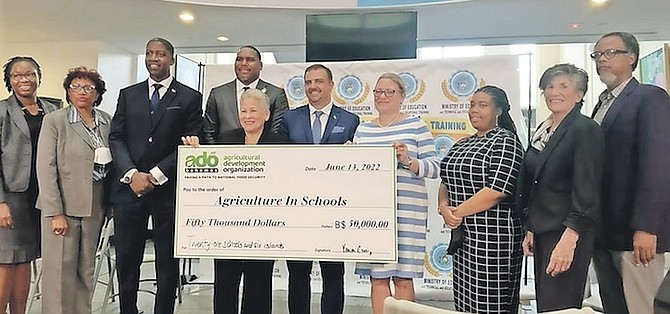 OFFICIALS from the Ministry of Education and the Ministry of Agriculture and Marine Resources receive a $50,000 donation from Agricultural Development Organization for the development of agriculture in 21 schools across The Bahamas.