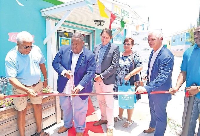 JOHN H Pinder II MP in attendance for a ribbon cutting to mark one year of Exuma Markets.