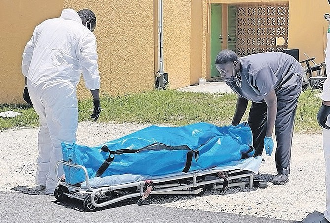 A BODY being removed from the scene at AF Adderley on Sunday.