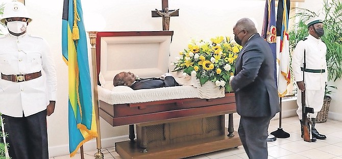PRIME Minister Philip “Brave” Davis pays his respects to former diplomat Dr Eugene Newry yesterday. Photos: Donavan McIntosh/Tribune Staff