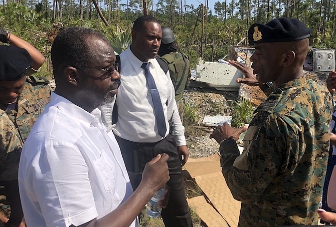 NATIONAL Security Minister Wayne Munroe (left) on the tour of deforested areas in a National Pine Forest ride along in the Carmichael Road area.