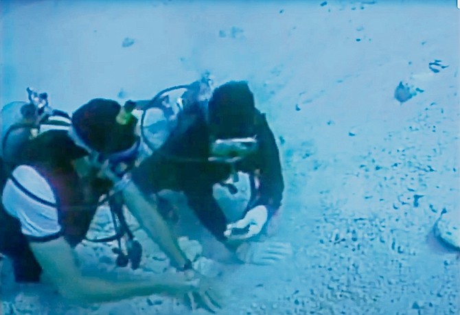 An image from video showing the Allen Exploration treasure hunters at work.