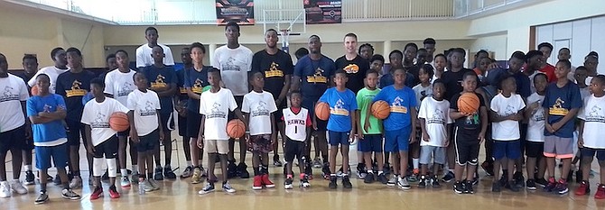DREAM Again Basketball Camp instructors and campers pose above. Photos by Alecia Thompson
