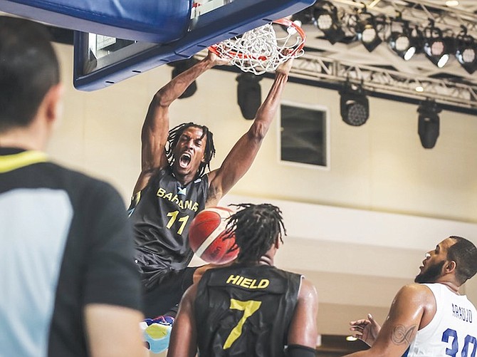 DANRAD KNOWLES, of the Bahamas, dunks last night against the Dominican Republic during the FIBA World Cup 2023 Americas Qualifiers at the Baha Mar resort in Cable Beach.