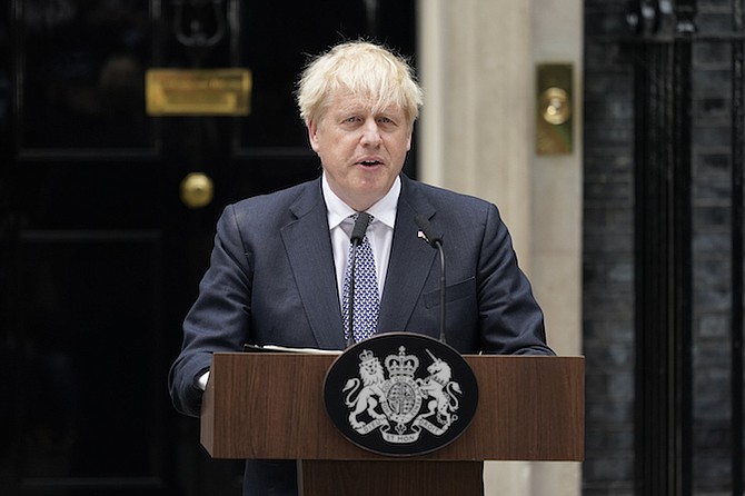 British Prime Minister Boris Johnson speaks to media next to 10 Downing Street in London, Thursday. (AP Photo/Alberto Pezzali)