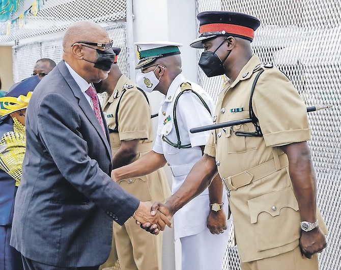 GOVERNOR General CA Smith greeting Deputy Commissioner of Police Leamond Delevaux ahead of
the library opening ceremony at the women’s prison. Photo: Austin Fernander