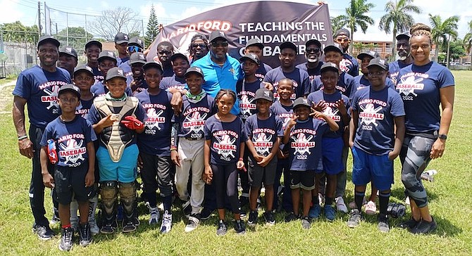 PARTICIPANTS enjoy the Mario Ford Baseball Camp with Minister of Youth, Sports and Culture Mario Bowleg. Photos courtesy of Tommy Stubbs