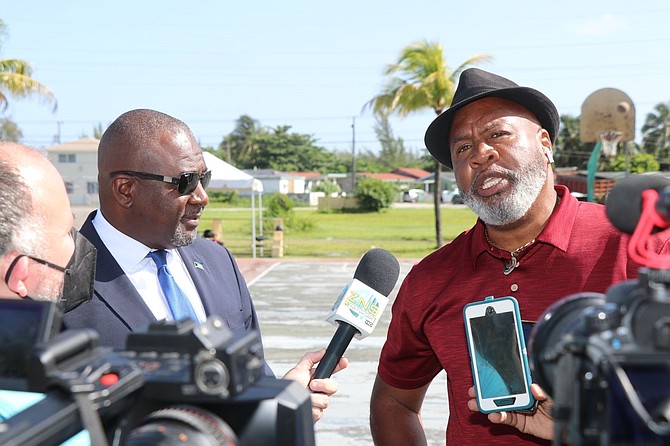 MINISTER of Youth, Sports and Culture Mario Bowleg, left, and the organiser, Apostle Carlos Reid, talk about about the Pastors vs Politicians game.
Photo by Eric Rose
