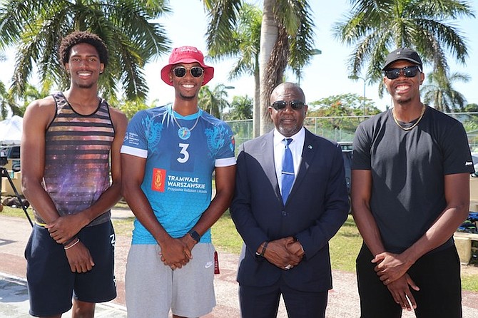 MINISTER of Youth, Sports and Culture Mario Bowleg with professional volleyball players Eugene Stuart and Shonari Hepburn, along with collegian Ras Jesse Delancy.