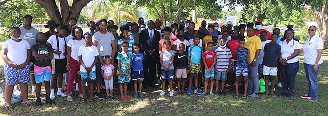 MINISTER of Youth, Sports and Culture Mario Bowleg is flanked by instructors and campers. Photos courtesy of Eric Rose