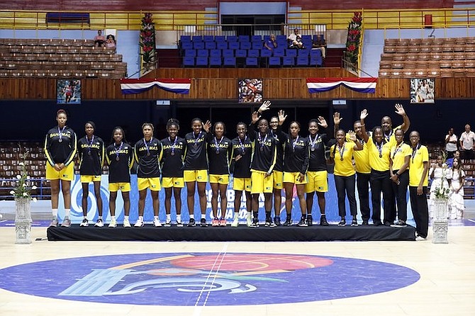 THE SENIOR women’s national basketball team celebrate with their bronze medals at the FIBA Caribbean Women’s Basketball Championships yesterday in Havana, Cuba.