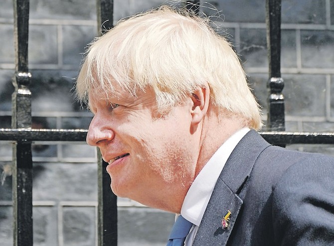 BRITAIN’S Prime Minister Boris Johnson leaves 10 Downing Street to attend the weekly Prime Ministers’ Questions session in parliament in London yesterday. 
Photo: Frank Augstein/AP