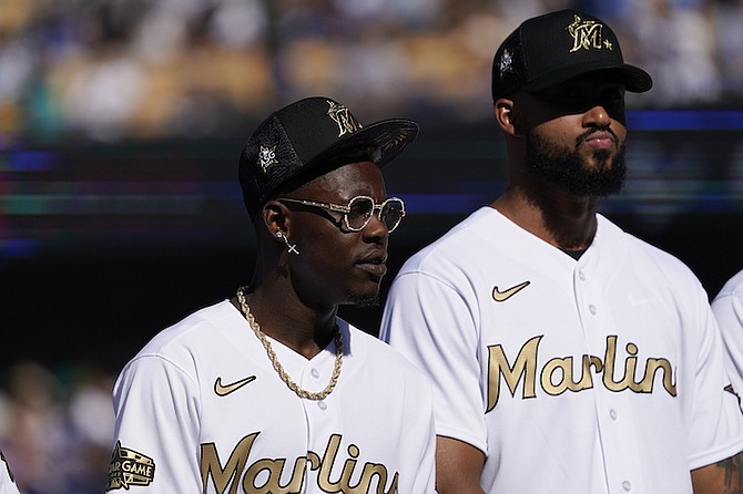 NATIONAL League second baseman Jazz Chisholm Jr., left, and pitcher Sandy Alcantara, both of the Miami Marlins, are introduced prior to the MLB All-Star baseball game against the American League, Tuesday, July 19, 2022, in Los Angeles. 
(AP Photo/Mark J Terrill)
