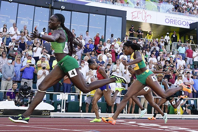 Devynne Charlton (pictured in the background on the right) in the women’s 100m hurdles final at the World Athletics Championships.