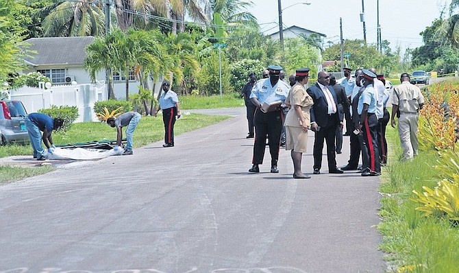 OFFICERS at the scene of yesterday’s fatal shooting in Pinewood Gardens. Photos: Moise Amisial