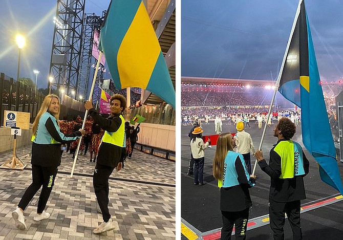 Lilly Higgs and Izaak Bastian with the Bahamian flag at the opening ceremonies for the 2022 Commonwealth Games.