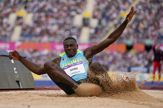 LaQuan Nairn competes in the men's long jump qualifying during the athletics in the Alexander Stadium at the Commonwealth Games in Birmingham, England, Tuesday. (AP Photo/Alastair Grant)