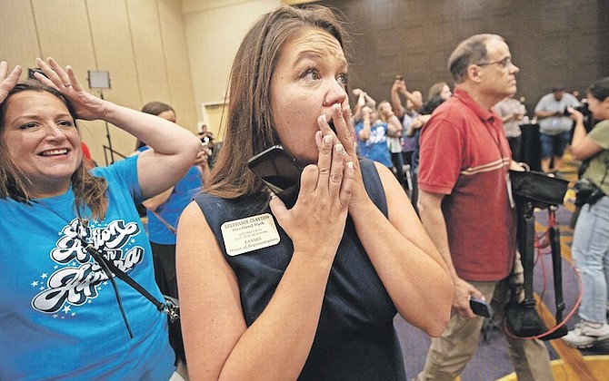 STATE Rep Stephanie Clayton, D-Overland Park, reacts on Tuesday at the Overland Park Convention Center in Kansas to election returns on an abortion referendum. Kansas voters on Tuesday protected the right to get an abortion in their state, rejecting a measure that would have allowed their Republican-controlled legislature to tighten abortion restrictions or ban it outright. Photo: Evert Nelson/The Topeka Capital-Journal via AP