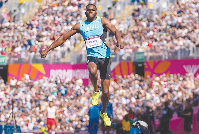 KAIWAN Culmer of the Bahamas competes in the men’s triple jump final during the athletics in the Alexander Stadium at the Commonwealth Games in Birmingham, England, yesterday. (AP Photo/ Alastair Grant)