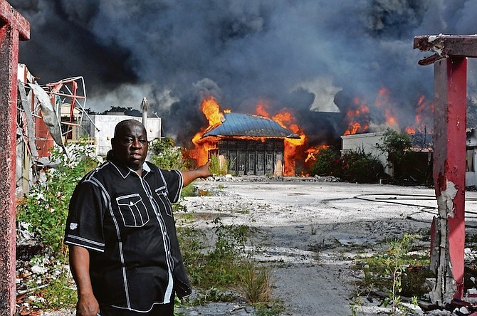 SENATOR Kirkland Russell points towards the latest blaze in Grand Bahama.
Photo: Vandyke Hepburn