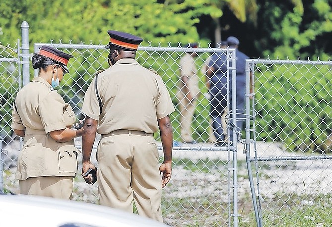 POLICE at the scene after a child drowned at the Seabreeze canal yesterday.
Photo: Austin Fernander