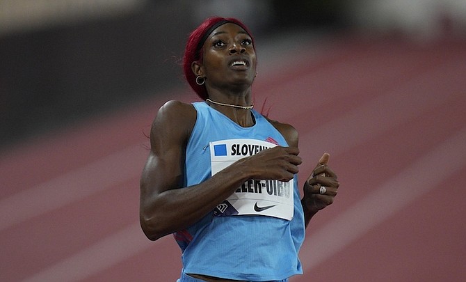 SHAUNAE MILLER-UIBO, of The Bahamas, wins the final of the 400 metres during the Diamond
League athletics meeting at the Louis II stadium in Monaco yesterday.
(AP Photo/Daniel Cole)