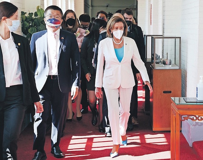 US House Speaker Nancy Pelosi, right, and Legislative Yuan Deputy Speaker Tsai Chi-chang arrive for a meeting in Taipei, Taiwan, on Wednesday last week.