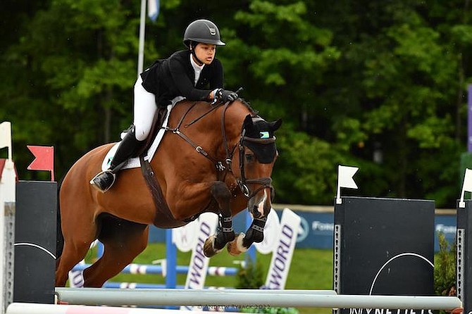 BAHAMIAN show jumper Kacy Lyn Smith and her horse Chicago M won the Farewell Competition at the FEI North American Youth Jumping Championships in Traverse City, Michigan. 
Photos courtesy of Andrew Ryback Photography