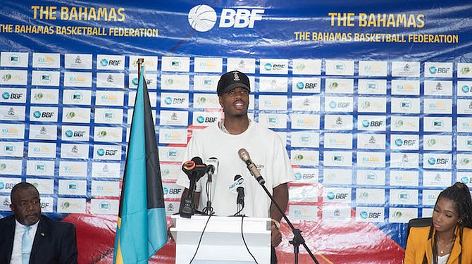 TEAM SPIRIT: Grand Bahamian Chavano “Buddy” Hield, of the NBA’s Indiana Pacers, speaks yesterday during a press conference ahead of Team Bahamas’ game against Venezuela in the 2023 FIBA Americas Cup Qualifier on Thursday night at the Kendal Isaacs Gymnasium. Also pictured are Minister of Youth, Sports and Culture Mario Bowleg and Jurelle Nairn-Mullings, BBF secretary. 
Photo: Moise Amisial/Tribune Staff