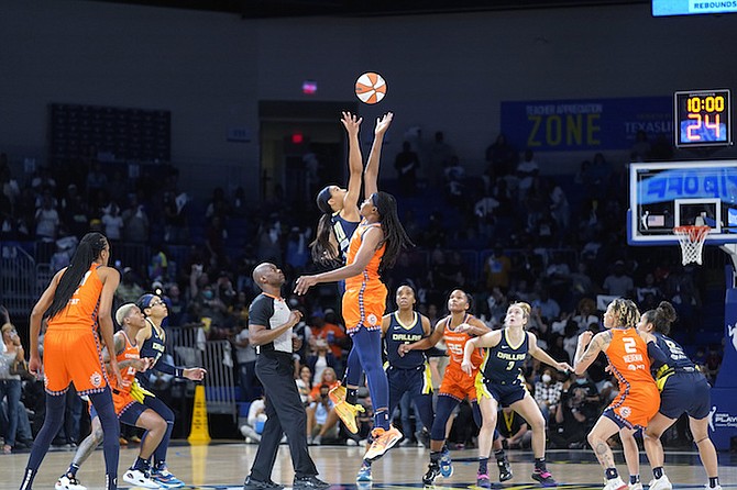 Connecticut Sun forward Jonquel Jones (35) and Dallas Wings forward Isabelle Harrison (20) jump for the ball at the opening of the first quarter during Game 3 of a WNBA first-round playoff series basketball game in Arlington, Texas, Wednesday, Aug. 24, 2022. (AP Photo/LM Otero)
