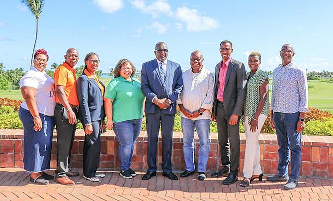 SHOWN, from left to right, are Recina ‘Scully’ Ferguson, volunteer, Bahamas Feeding Network, Crestwell Gardiner, vice president of lending, Fidelity Bank, Quatrenda Sears, senior administrative assistant, Fidelity Bank, Ashley Bethel, marketing manager, Better Homes and Gardens MCR Bahamas, Minister of Youth, Sports and Culture Mario Bowleg, Felix Stubbs, chairman, Bahamas Feeding Network, Timothy Munnings, Director of Youth, Sports and Culture, Pauline Davis-Thompson, Archdeacon James Palacious, executive director of the Bahamas Feeding Network.