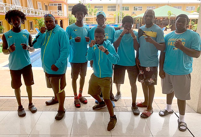 DUKES UP: Members of the High School/Junior Boxing Championship team. Shown, from left to right, in the back row are Jailen Young, assistant coach Vincent Deleveaux, Jaiden Young, Vincent Strachan, Keano Cox, head coach Carl Hield and Elijah Smith. In the front row is Andrew Curtis.