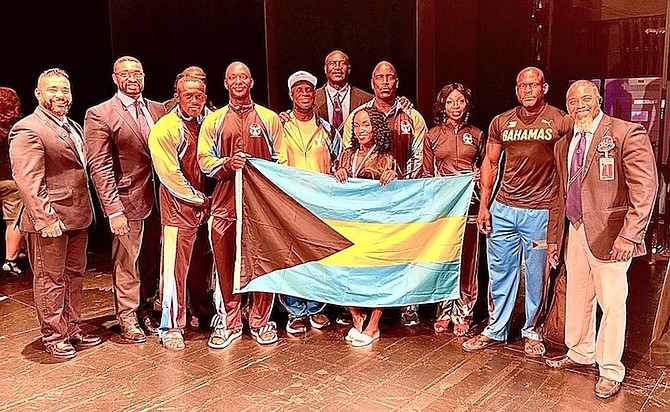 TEAM Bahamas standing proud with the national flag.