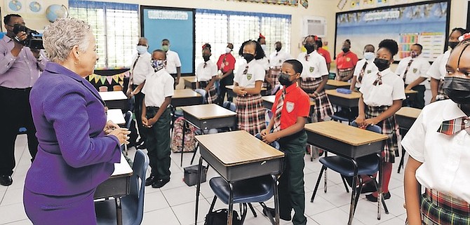 EDUCATION Minister Glenys Hanna Martin speaking to students during a tour of schools around the capital on the first day of classes. Photos: Austin Fernander
