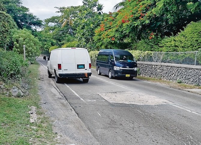 TRAFFIC veering around a gaping hole on Eastern Road yesterday.