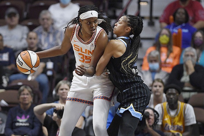 Connecticut Sun forward Jonquel Jones is guarded by Chicago Sky forward Candace Parker during the first half of Game 4 of a WNBA basketball playoff semifinal, Tuesday, Sept. 6, 2022, in Uncasville, Conn. (AP Photo/Jessica Hill)