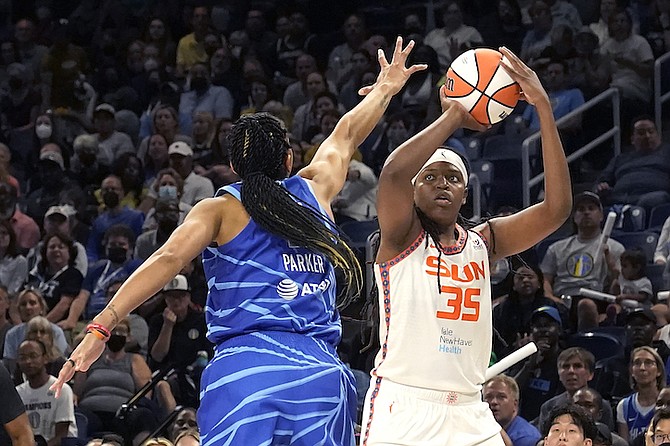 Connecticut Sun's Jonquel Jones shoots over Chicago Sky's Candace Parker during the first half of Game 5 in a WNBA basketball playoffs semifinal Thursday, Sept. 8, 2022, in Chicago. (AP Photo/Charles Rex Arbogast)