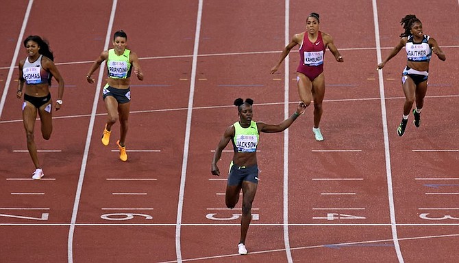 GABRIELLE THOMAS, of the United States in 2nd, Jenna Prandini of the United States in 4th, Shericka Jackson of Jamaica wins, Mujinga Kambundji of Switzerland 5th and Tynia Gaither of The Bahamas 6th, from left, compete in the 200m during the Weltklasse IAAF Diamond League international athletics meeting at the Letzigrund stadium in Zurich, Switzerland, yesterday. 
(Michael Buholzer/Keystone via AP)